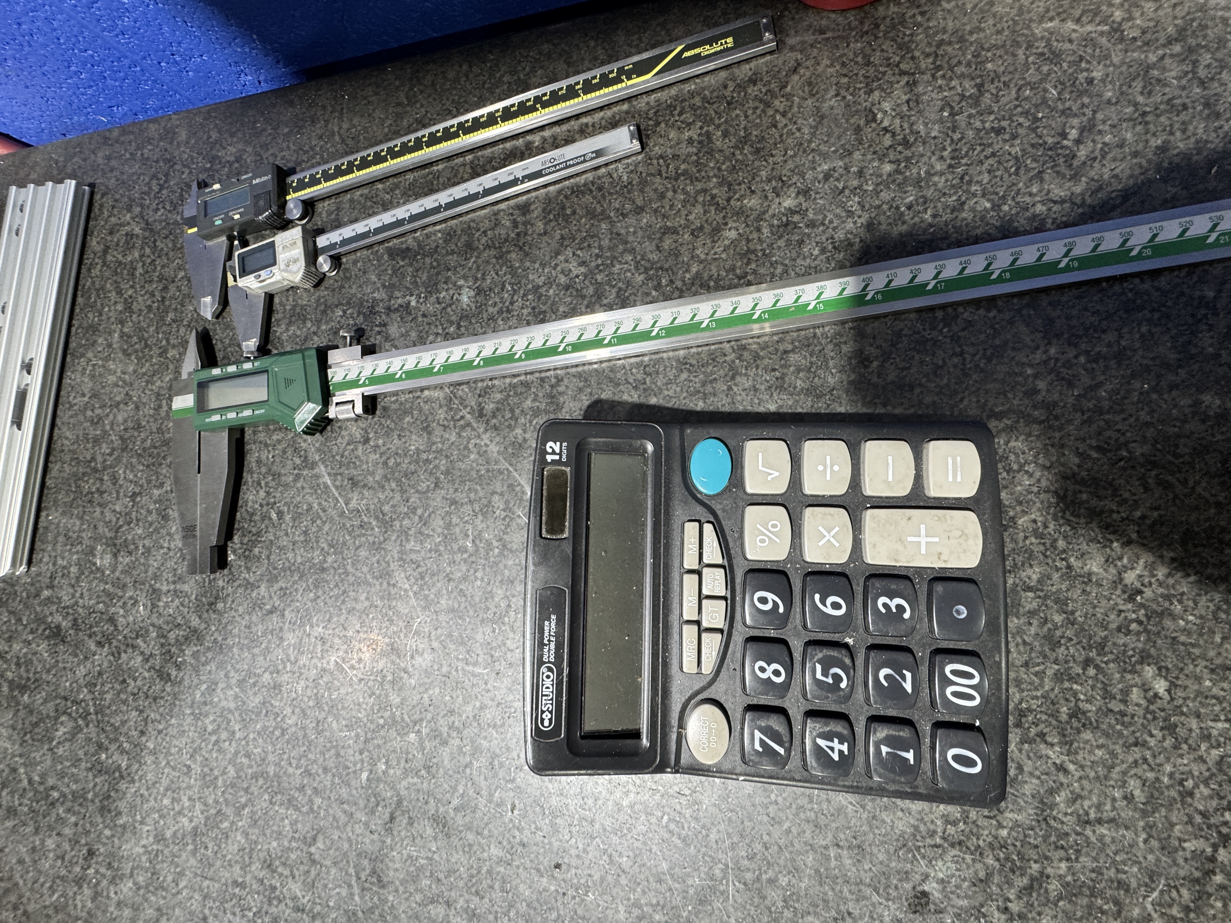 Inspection tools and measuring equipment laid out on a work surface